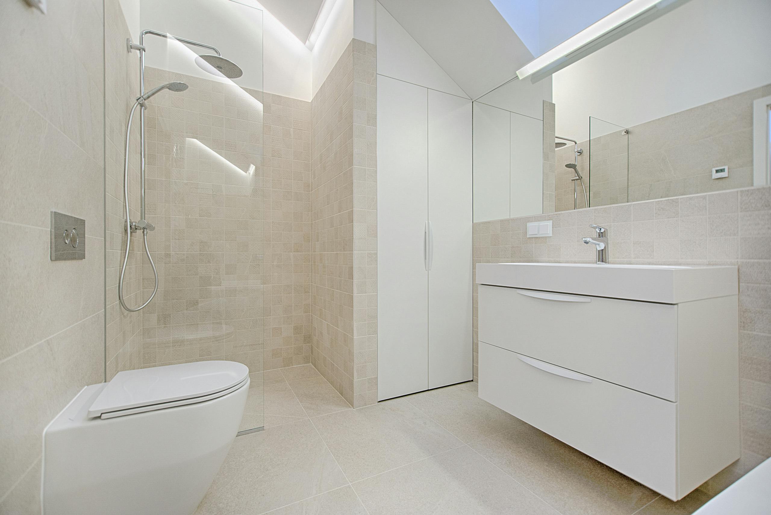 Toilet Repair In Raleigh, Nc 2 - Streamline Services Bright And Luxurious Bathroom With Contemporary Fixtures And Sleek Design.